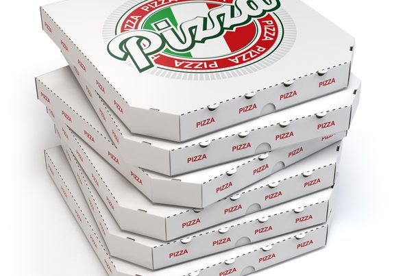 A set of personalized pizza boxes with each box resting atop the other